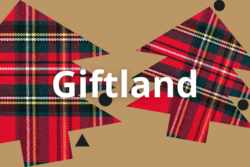 l'immagine rappresenta la locandina dell'evento con 2 sagome di abeti in tessuto scozzese, sfondo beige e la scritta giftland in mezzo